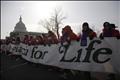 Pro-life protesters walk past the U.S. Capitol Building on their way to the Supreme Court during their annual March for Life in Washington