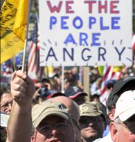 Protestors hold signs as several groups hold a 'Kill the Bill' rally against Obama's health care legislation, on the west front of the U.S. Capitol in Washington