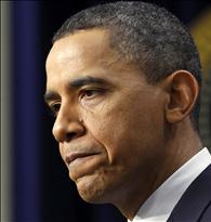 U.S. President Barack Obama pauses as he answers a question from a reporter during a news conference at the White House in Washington