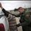 Border patrol agent catches illegal immigrant crossing into US.