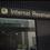 Woman walks out of Internal Revenue Service building (IRS)