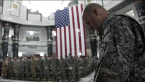 U.S. soldiers pray during a ceremony marking the 7th anniversary of the September 11 attacks in the United States, at the Al Faw palace in a U.S. military camp in Baghdad